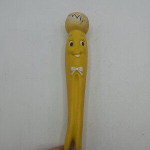 Vintage Yellow Clothespin Rubber Squeak Toy with Smiling Face